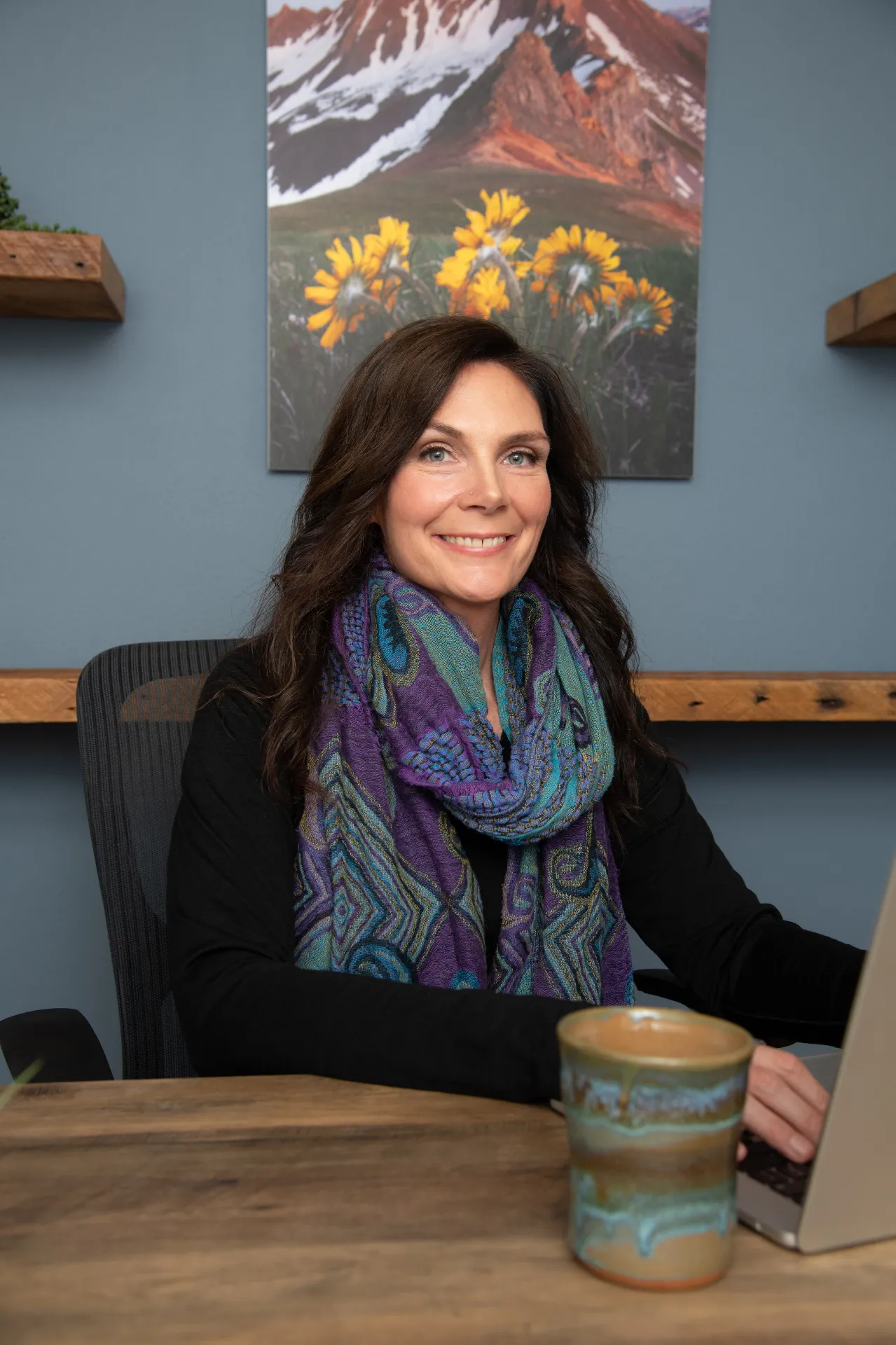 Michelle Mullins at her desk in the Areté clinic office